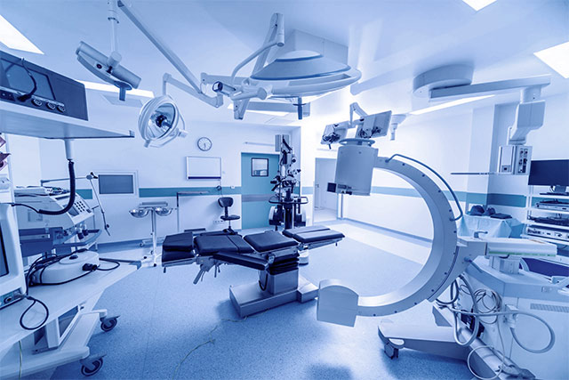Modern hospital operating room with advanced medical equipment, highlighting EquipNow, CapitalPlanning, and Disposition healthcare solutions.
